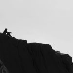 image of someone sitting on a hill